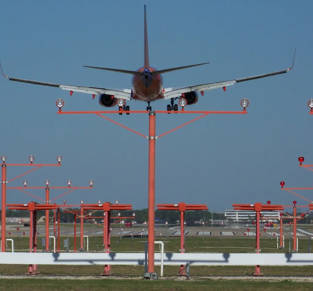 A plane is flying low to the ground.